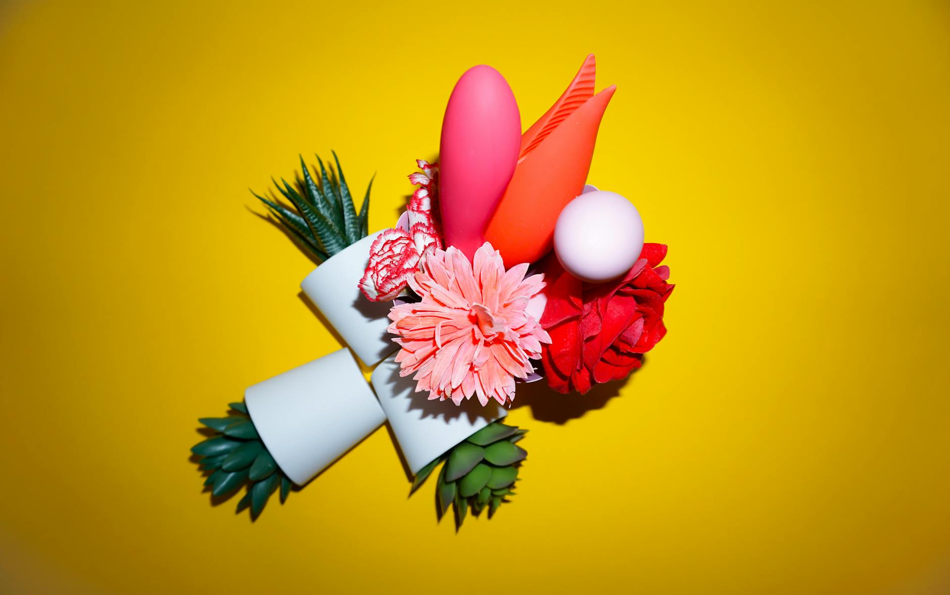 A hand holding an orange vibrator against a minimalistic purple backdrop, symbolizing modern approaches to intimate wellness.